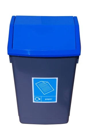 A dark grey bin with a blue, angled lid, featuring a blue and white label with a recycling symbol and a paper icon.